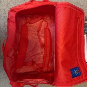 Baboon to the Moon tangerine Go bag 60L